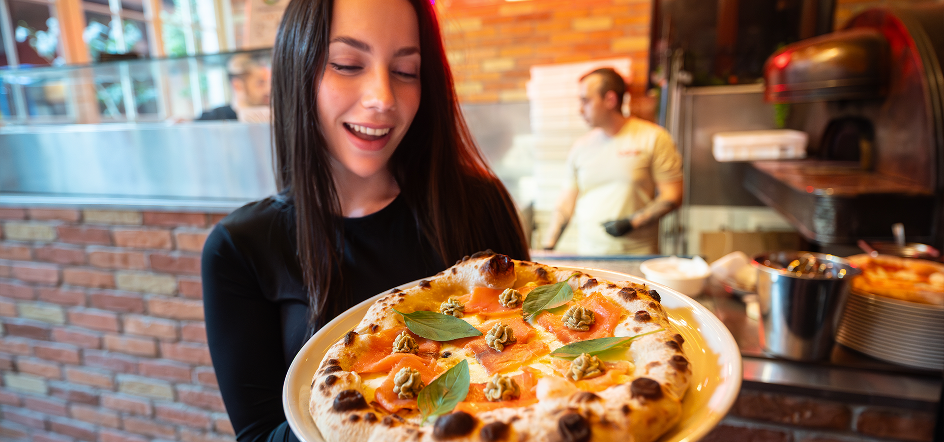 A dimly lit restaurant with lots of bottles of wine.
